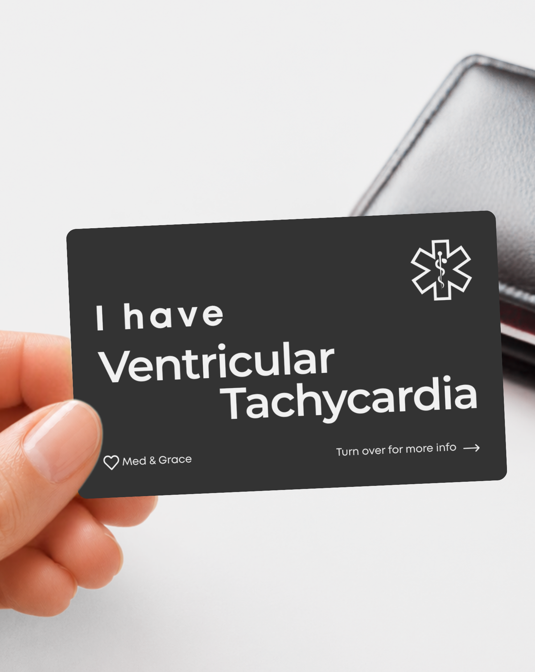 Black Ventricular Tachycardia engraved medical alert card held in hand