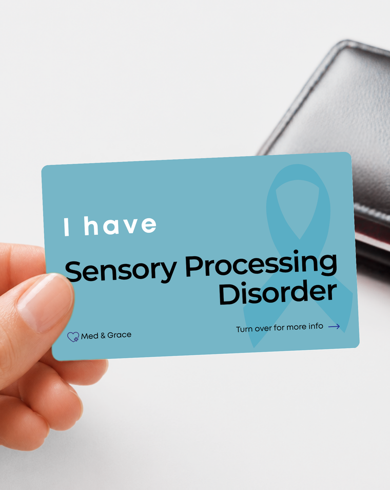 Teal Sensory Processing Disorder medical alert card held in hand