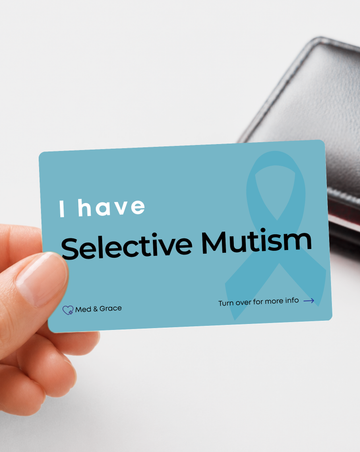 Teal Selective Mutism medical alert card held in hand