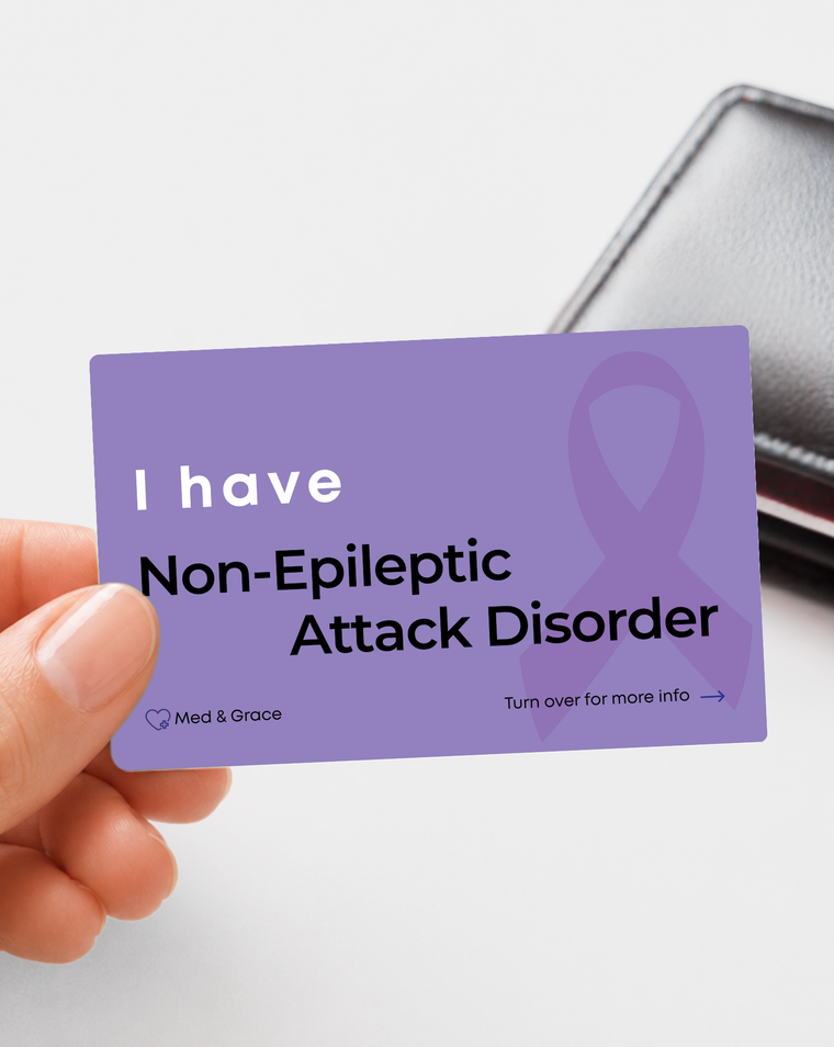 Purple Non-Epileptic Attack Disorder (NEAD) medical alert card held in hand
