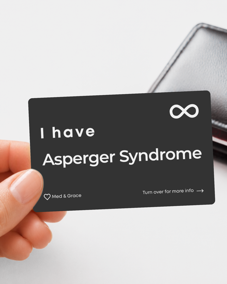 Black Asperger Syndrome engraved medical alert card held in hand