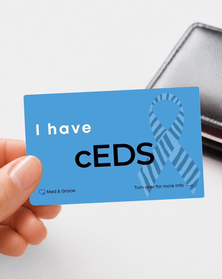 Blue cEDs - Classical Ehlers-Danlos Syndrome medical alert card held in hand