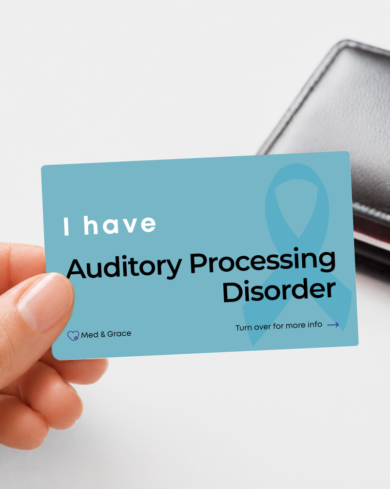 Teal Auditory Processing Disorder medical alert card held in hand