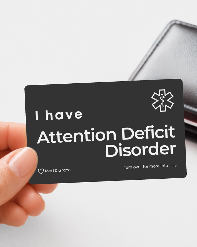 Black Attention Deficit Disorder (ADD) engraved medical alert card held in hand
