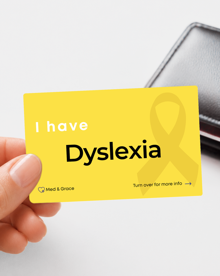 Yellow Dyslexia medical alert card held in hand