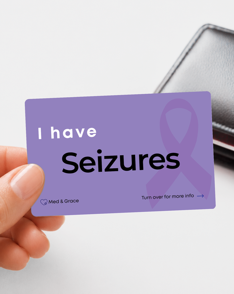 Purple Seizures medical alert card held in hand