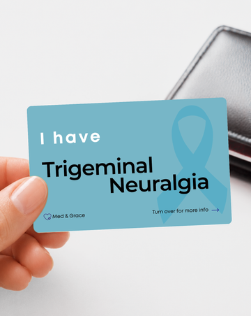 Teal Trigeminal Neuralgia medical alert card held in hand