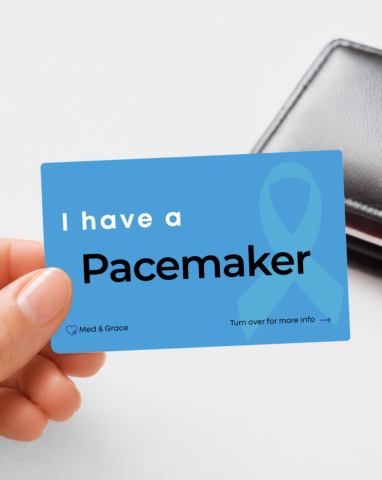Blue Pacemaker medical alert card held in hand