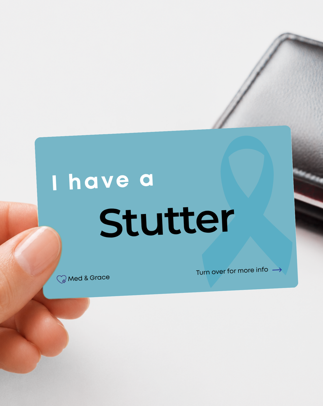 Teal Stutter medical alert card held in hand