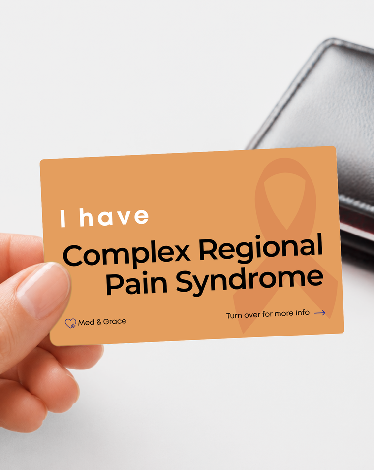 Orange Complex Regional Pain Syndrome (CRPS) medical alert card held in hand