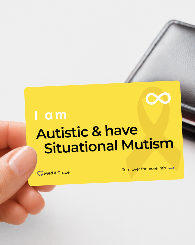 Yellow Autistic and Situational Mutism medical alert card held in hand