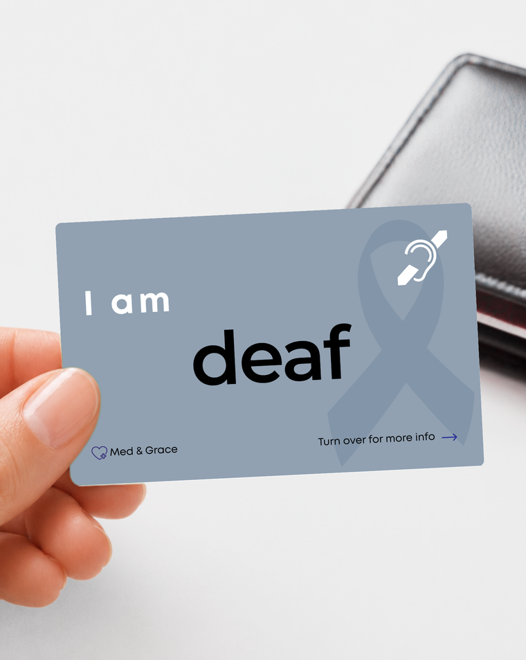 Grey deaf (Lowercase d) medical alert card held in hand
