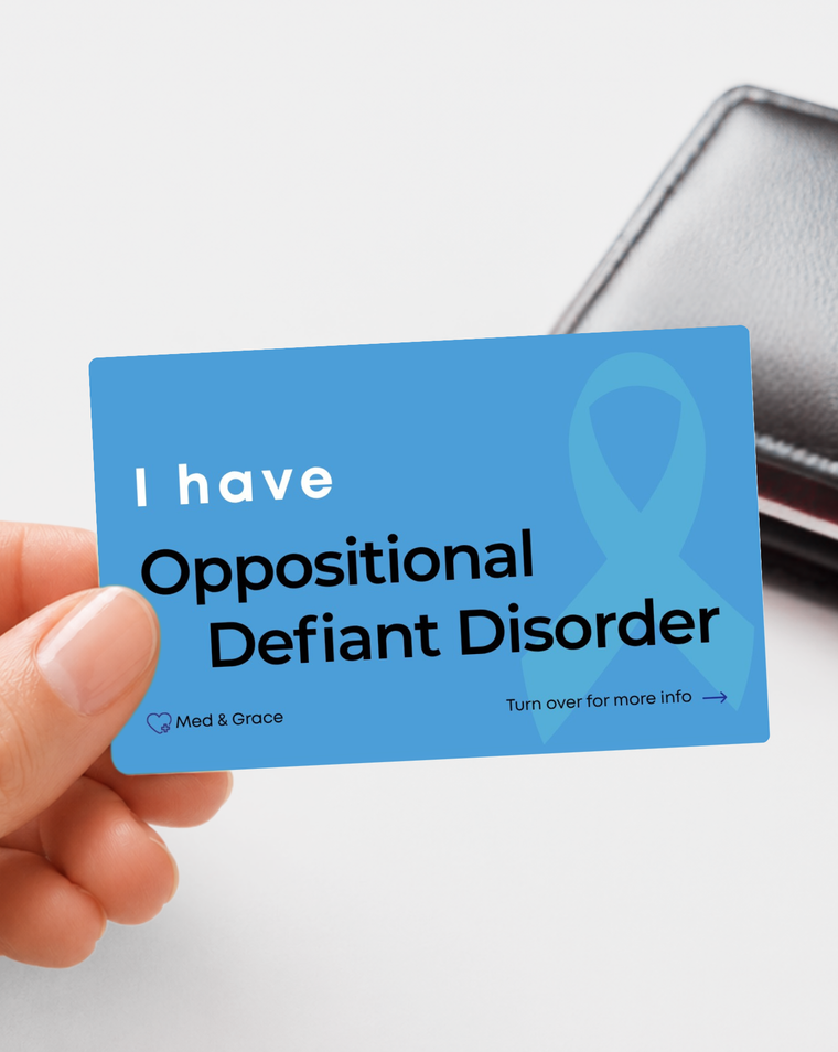 Blue Oppositional Defiant Disorder (ODD) medical alert card held in hand