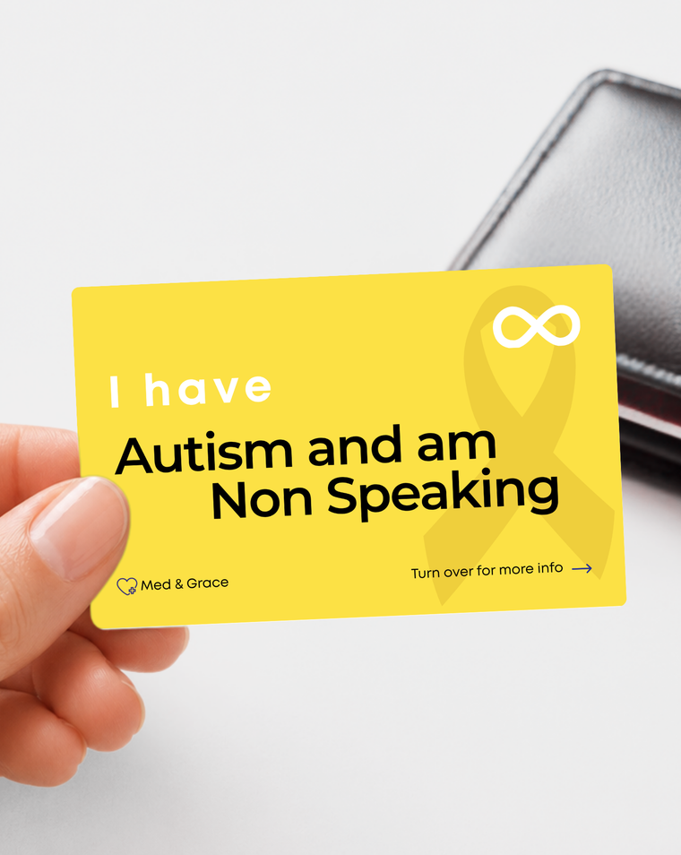 Yellow Autism and am Non Speaking medical alert card held in hand