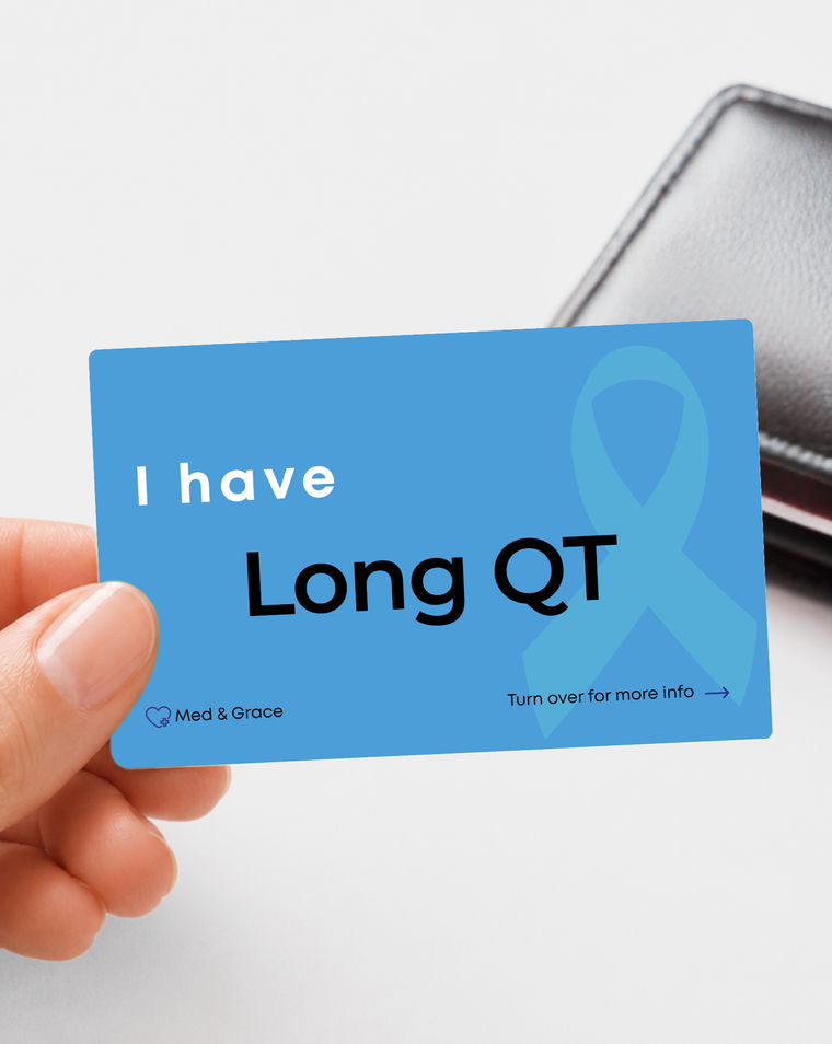 Blue Long QT medical alert card held in hand