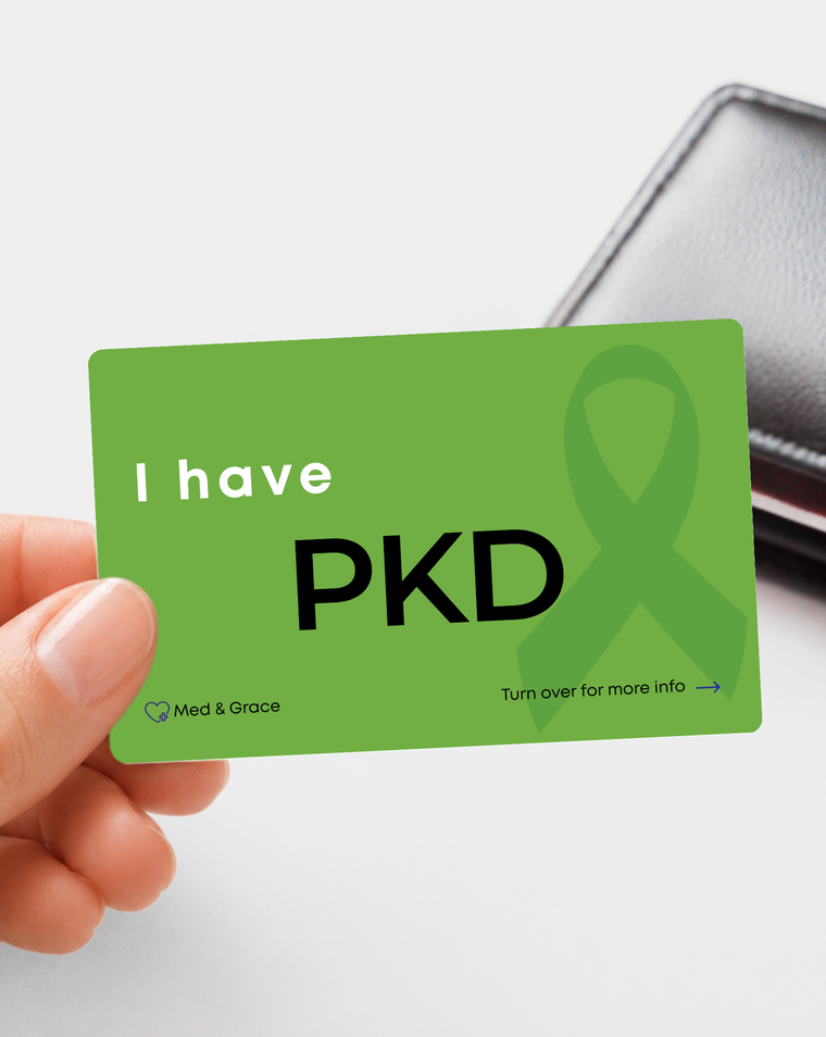 Green PKD (Polycystic Kidney Disease) medical alert card held in hand