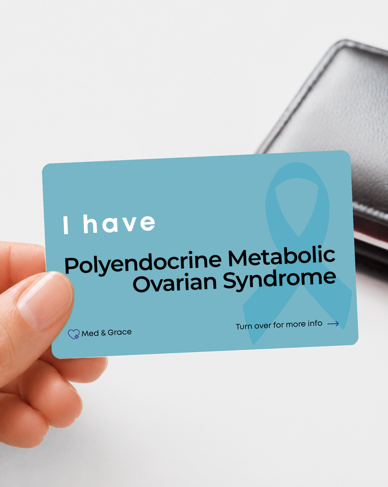 Teal Polyendocrine Metabolic Ovarian Syndrome (PCOS) medical alert card held in hand